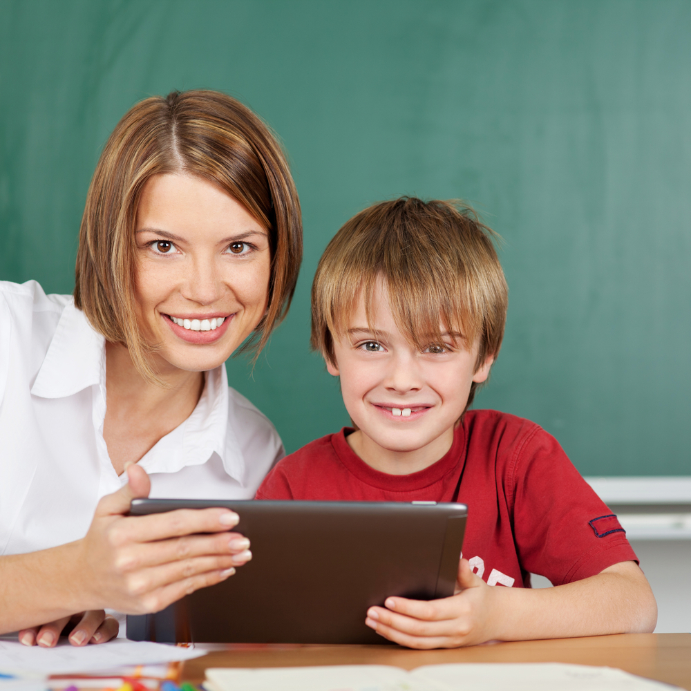 Teacher and student during lesson with tablet