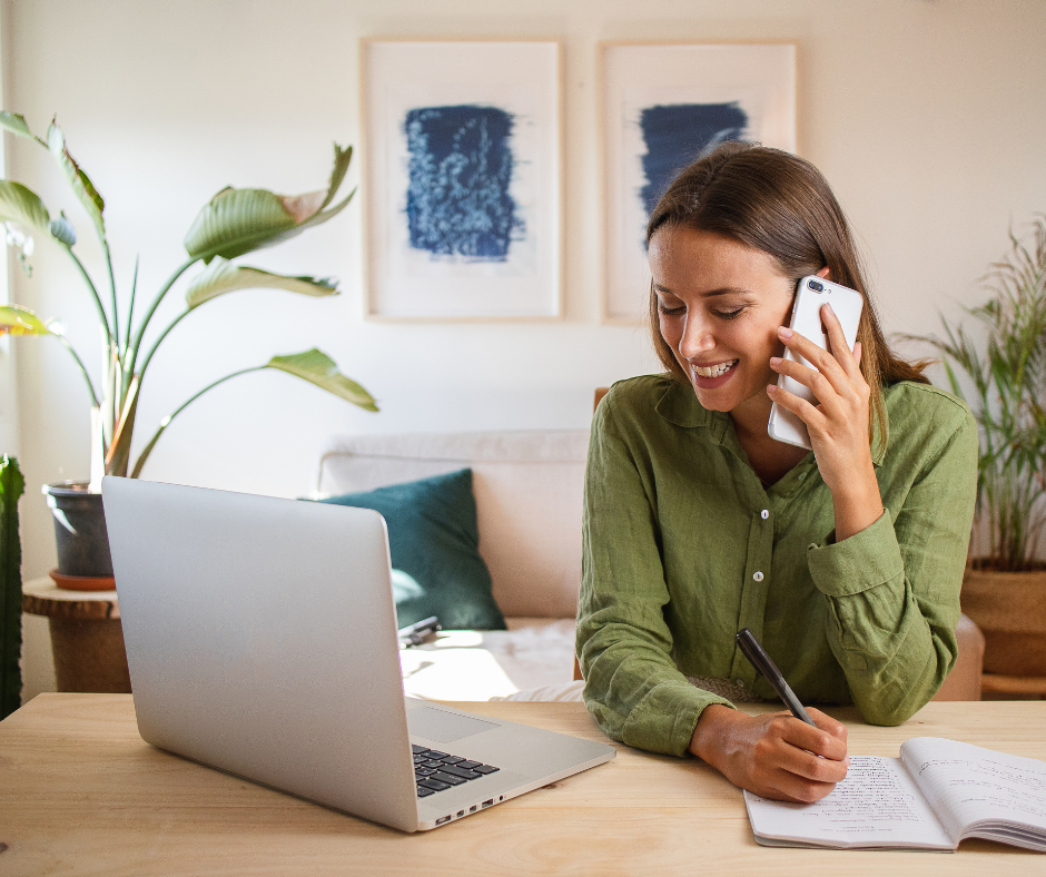 woman working from home on phone and laptop